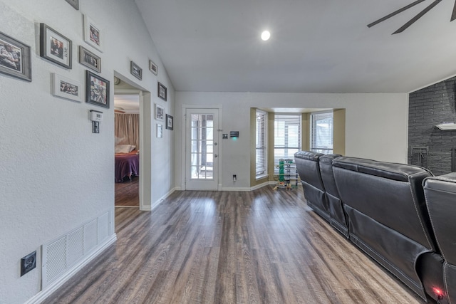 106 Guinevere Ct, Weatherford, TX 76086 - living room featuring ceiling fan, visible vents, baseboards, wood finished floors, and vaulted ceiling