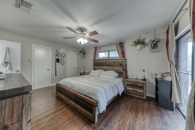 106 Guinevere Ct, Weatherford, TX 76086 - bedroom featuring a textured ceiling, a ceiling fan, wood finished floors, and visible vents