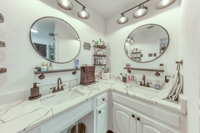 106 Guinevere Ct, Weatherford, TX 76086 - bathroom featuring a sink, double vanity, and visible vents
