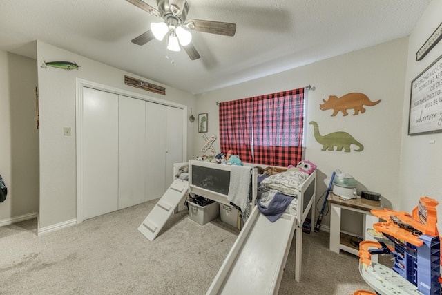 106 Guinevere Ct, Weatherford, TX 76086 - bedroom with a closet, carpet flooring, baseboards, and a ceiling fan
