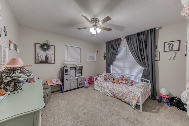 106 Guinevere Ct, Weatherford, TX 76086 - bedroom with carpet floors, a ceiling fan, and a textured ceiling