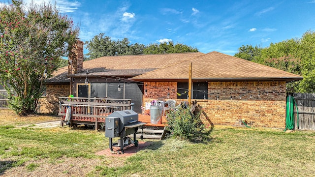 106 Guinevere Ct, Weatherford, TX 76086 - back of property with roof with shingles, a wooden deck, and brick siding