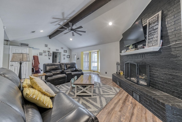 106 Guinevere Ct, Weatherford, TX 76086 - living area with ceiling fan, lofted ceiling with beams, a brick fireplace, baseboards, and wood finished floors