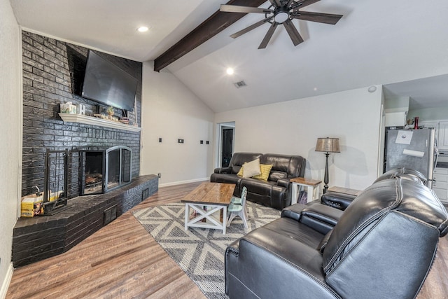 106 Guinevere Ct, Weatherford, TX 76086 - living room featuring ceiling fan, lofted ceiling with beams, baseboards, wood finished floors, and visible vents