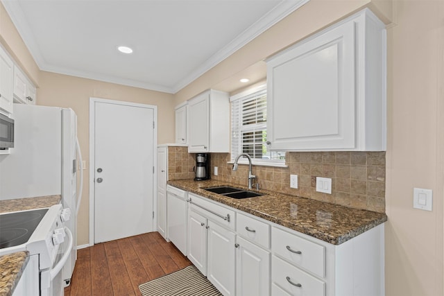 5008 Santa Elena Ct, Granbury, TX 76049 - kitchen with white cabinets, a sink, tasteful backsplash, dark wood-style flooring, and white appliances