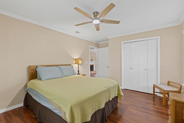 5008 Santa Elena Ct, Granbury, TX 76049 - bedroom featuring dark wood-style flooring, a ceiling fan, a closet, baseboards, and ornamental molding