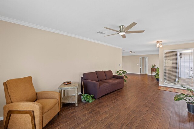 5008 Santa Elena Ct, Granbury, TX 76049 - living area with crown molding, ceiling fan, baseboards, dark wood-style flooring, and visible vents