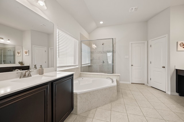 bathroom featuring a garden tub, vanity, tile patterned flooring, and tiled shower