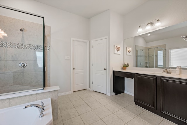 full bath with a stall shower, a bath, vanity, baseboards, and tile patterned flooring
