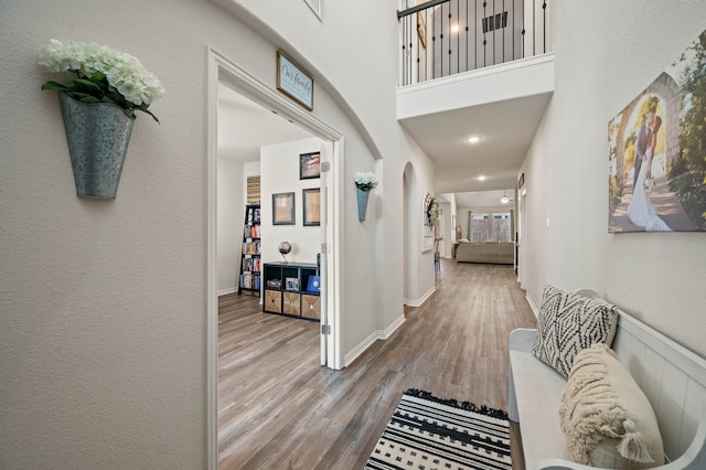 hall with wood finished floors