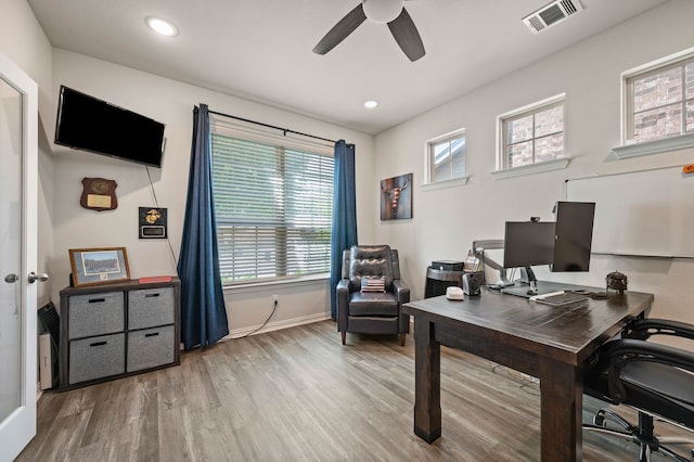 office featuring baseboards, visible vents, recessed lighting, a ceiling fan, and wood finished floors