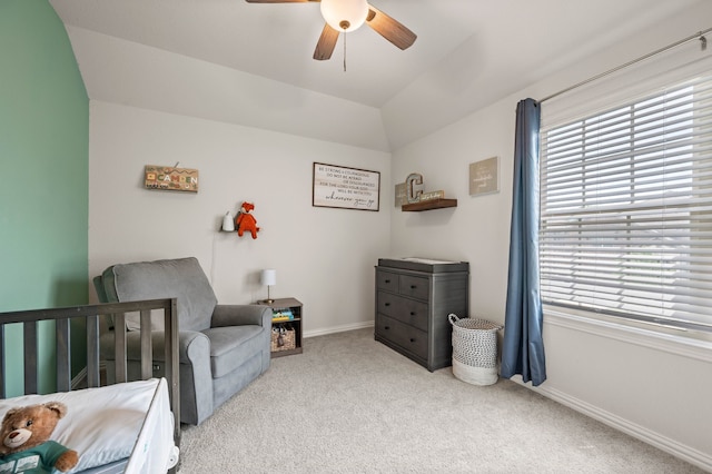 bedroom featuring baseboards, carpet flooring, ceiling fan, and multiple windows