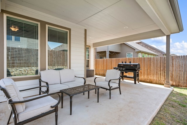 view of patio / terrace featuring fence, outdoor lounge area, and area for grilling