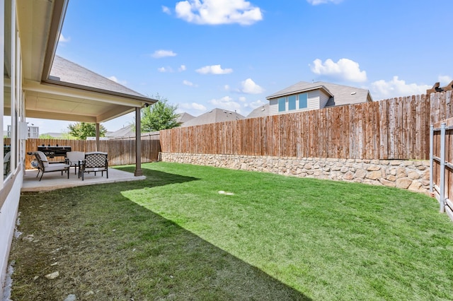 view of yard with a fenced backyard and a patio