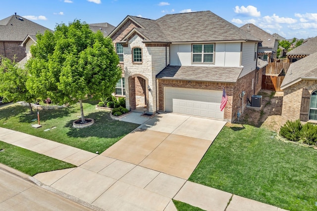 traditional home with roof with shingles, concrete driveway, brick siding, an attached garage, and a front yard