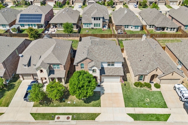 birds eye view of property with a residential view