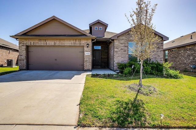view of front facade featuring a garage, concrete driveway, a front lawn, and brick siding