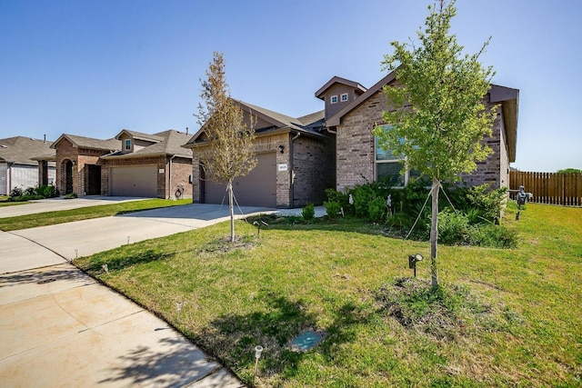 view of front of property with a garage, a front lawn, fence, brick siding, and driveway