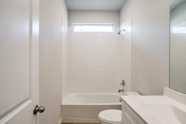 bathroom featuring shower / bathtub combination, vanity, and toilet