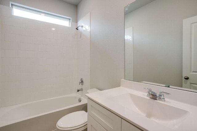 bathroom featuring vanity, toilet, and shower / washtub combination