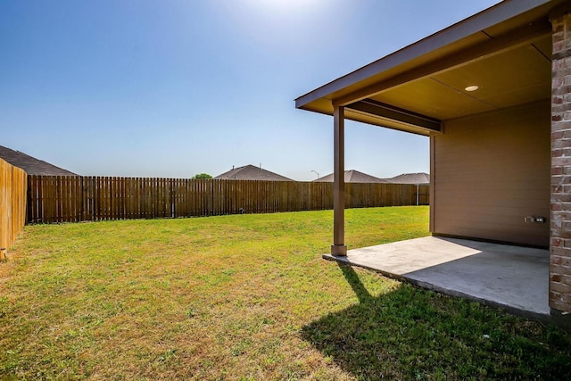 view of yard featuring a fenced backyard and a patio area