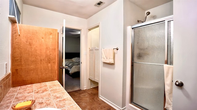 ensuite bathroom with ensuite bath, visible vents, and a stall shower