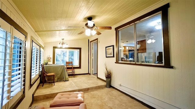 sunroom featuring a notable chandelier and a baseboard radiator