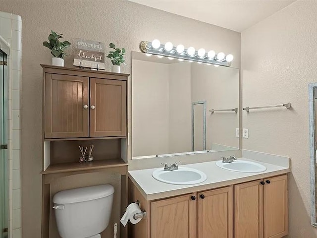 130 Walnut Dr, Seagoville, TX 75159 - bathroom with toilet, walk in shower, double vanity, and a sink