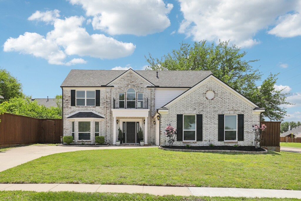 4116 Norcross Dr, Plano, TX 75024 - traditional-style home with fence, a front lawn, and brick siding