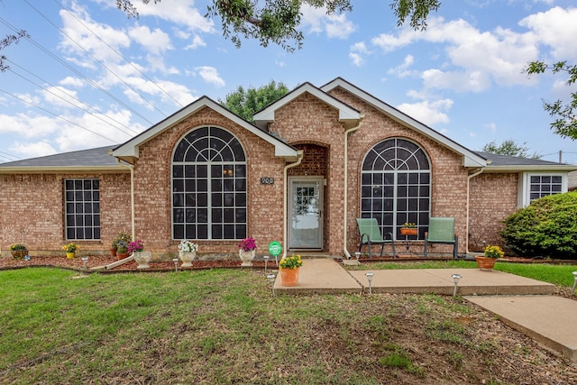 900 Valley View Dr, Lewisville, TX 75067 - ranch-style house featuring a front yard and brick siding