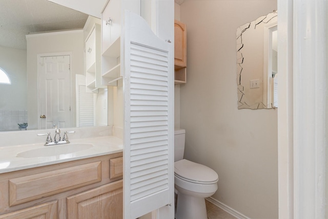 900 Valley View Dr, Lewisville, TX 75067 - bathroom with toilet, baseboards, tile patterned floors, and vanity