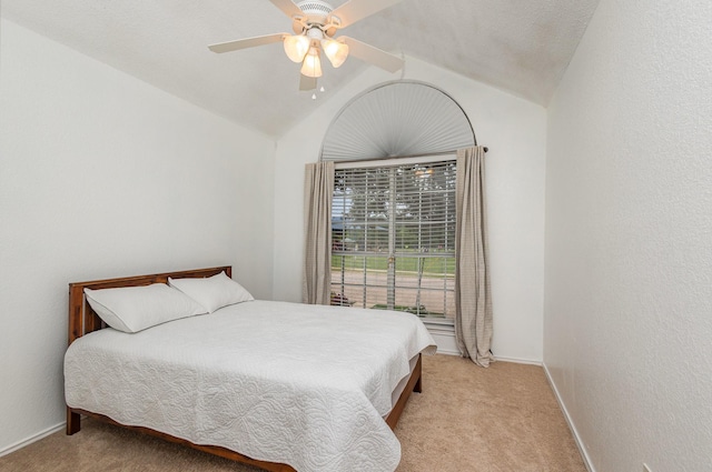 900 Valley View Dr, Lewisville, TX 75067 - bedroom featuring baseboards, light carpet, and vaulted ceiling