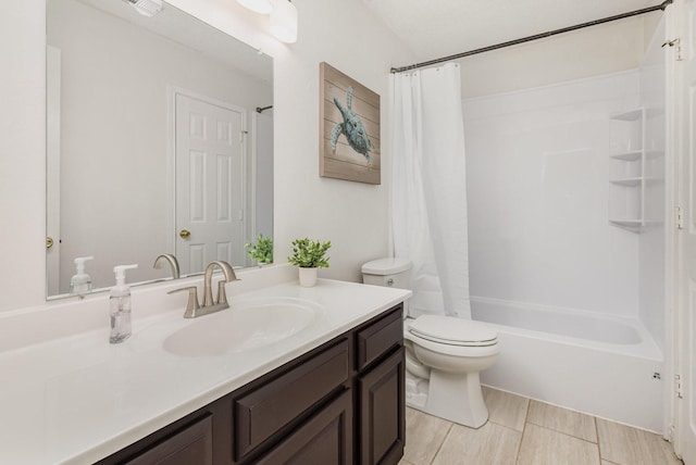 900 Valley View Dr, Lewisville, TX 75067 - bathroom featuring vanity, shower / bathtub combination with curtain, and toilet