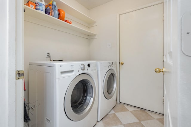 900 Valley View Dr, Lewisville, TX 75067 - clothes washing area featuring laundry area, washing machine and dryer, and light floors