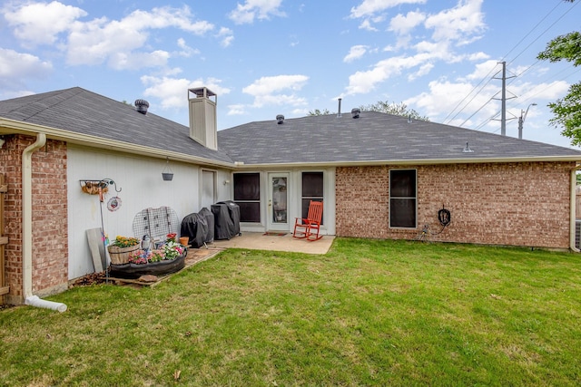 900 Valley View Dr, Lewisville, TX 75067 - back of property with a patio, a chimney, brick siding, a shingled roof, and a yard