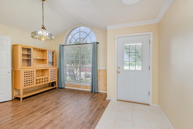 900 Valley View Dr, Lewisville, TX 75067 - foyer featuring light wood-style floors, baseboards, a notable chandelier, and lofted ceiling