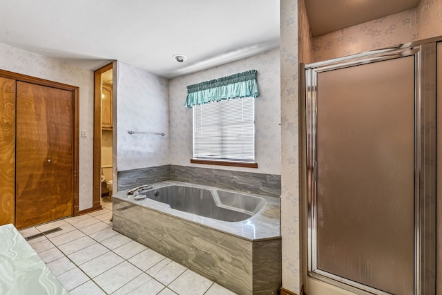 bathroom featuring wallpapered walls, a shower stall, tile patterned floors, toilet, and a bath