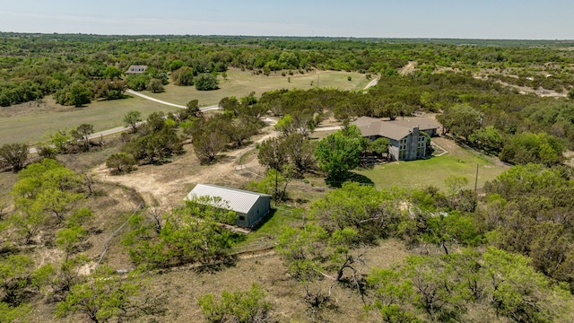 birds eye view of property with a rural view and a forest view