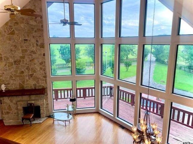 5181 Texas Highway 49, Mount Pleasant, TX 75455 - living area with a healthy amount of sunlight, ceiling fan, wood finished floors, and a high ceiling