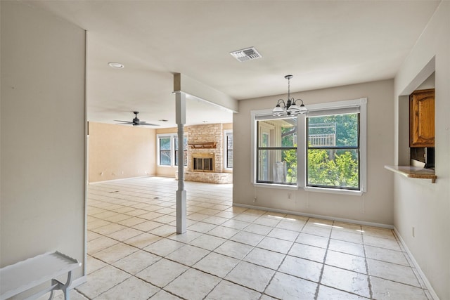 unfurnished dining area with baseboards, visible vents, and a healthy amount of sunlight