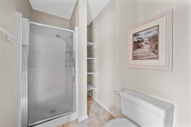 full bathroom with a shower stall, toilet, tile patterned flooring, and baseboards