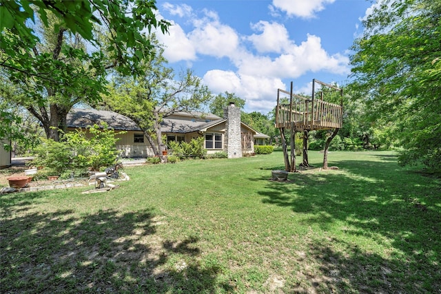 view of yard with a deck