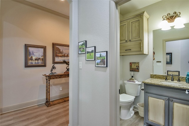 1601 Harbor Lakes Dr, Granbury, TX 76048 - bathroom featuring wood finished floors, toilet, vanity, and baseboards