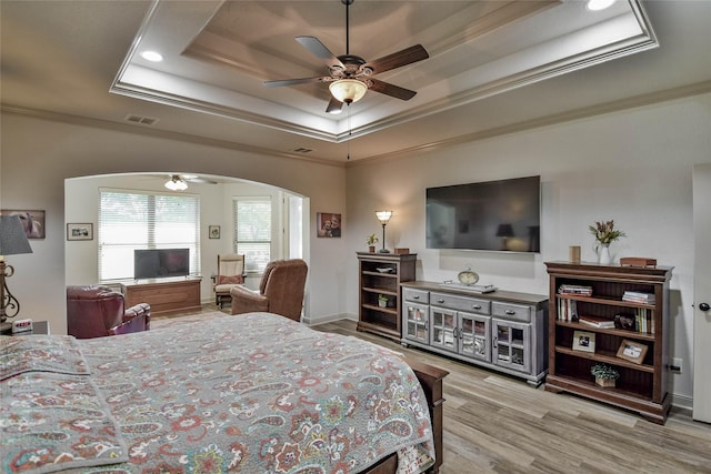 1601 Harbor Lakes Dr, Granbury, TX 76048 - bedroom with a raised ceiling, ornamental molding, arched walkways, wood finished floors, and a ceiling fan
