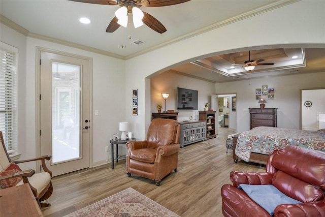 1601 Harbor Lakes Dr, Granbury, TX 76048 - living room with a ceiling fan, arched walkways, light wood-type flooring, ornamental molding, and baseboards
