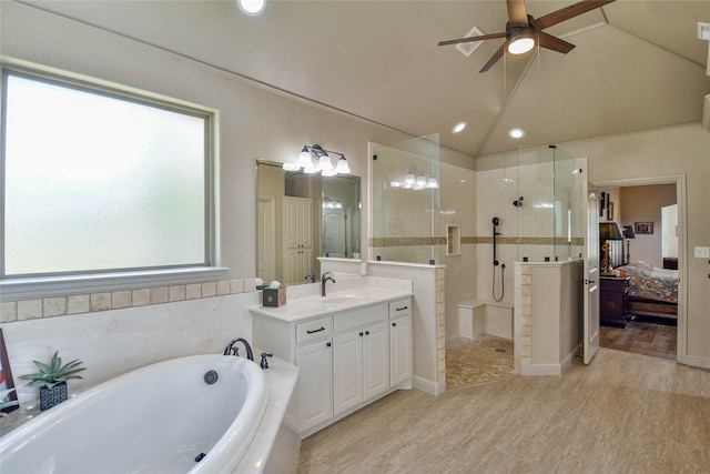 1601 Harbor Lakes Dr, Granbury, TX 76048 - ensuite bathroom with ceiling fan, a bath, a walk in shower, wood finished floors, and vanity
