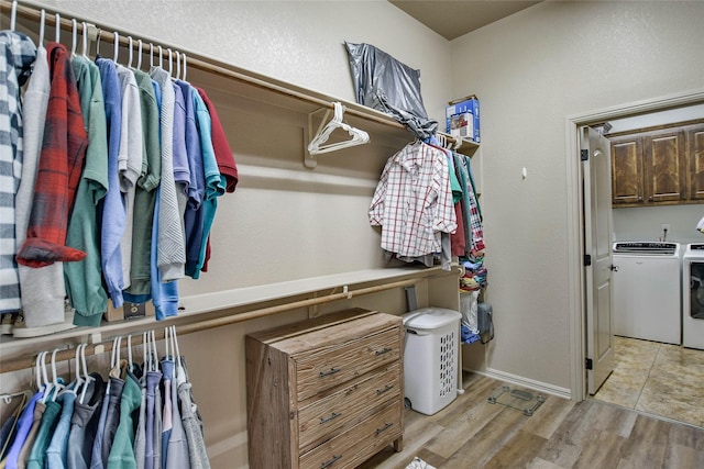 1601 Harbor Lakes Dr, Granbury, TX 76048 - walk in closet with washer and dryer and light wood finished floors