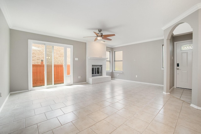 24 Cedar Ln, Bedford, TX 76021 - unfurnished living room with a ceiling fan, healthy amount of natural light, crown molding, baseboards, and light tile patterned floors