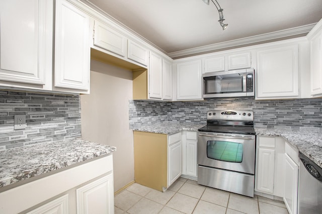 24 Cedar Ln, Bedford, TX 76021 - kitchen with stainless steel appliances, light tile patterned floors, tasteful backsplash, white cabinets, and light stone counters