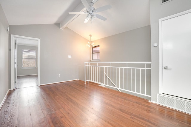 24 Cedar Ln, Bedford, TX 76021 - spare room with wood finished floors, a chandelier, a ceiling fan, and baseboards